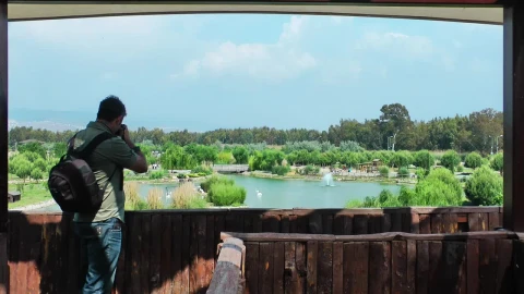 Stock Footage Videographer Panning Out Of A Lake Live Wallpaper - Free Live Wallpaper