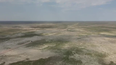Stock Footage Van Driving Down A Long Dusty Road Live Wallpaper - Free Live Wallpaper