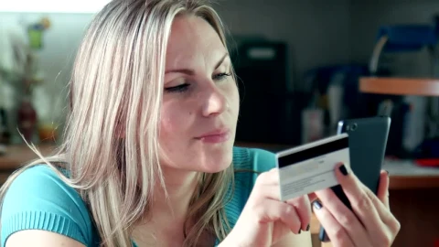 Stock Footage Young Woman Using The Phone With Credit Card Live Wallpaper Free - Free Live Wallpaper