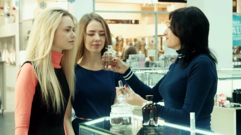 Stock Footage Young Woman Smelling Perfume On The Mall Live Wallpaper Free - Free Live Wallpaper