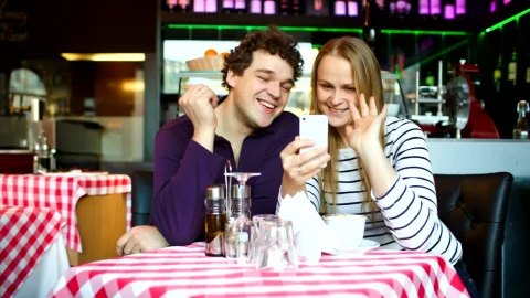 Stock Footage Young Couple On A Video Call In A Cafe Live Wallpaper Free - Free Live Wallpaper