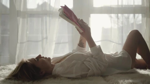 Stock Footage Woman Reading A Story Lying On The Bed Live Wallpaper Free - Free Live Wallpaper