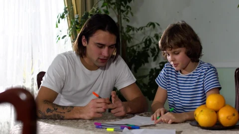 Stock Footage Young Father Teaches His Son To Do His Homework Live Wallpaper Free - Free Live Wallpaper