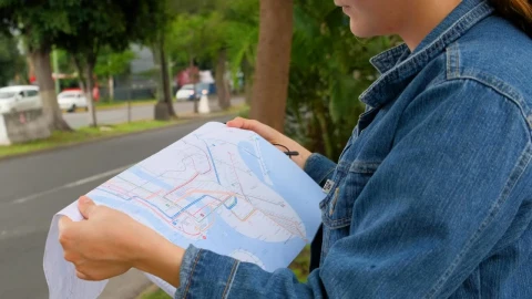 Stock Footage Woman On The Street Locating Herself With A Map Of Live Wallpaper Free - Free Live Wallpaper