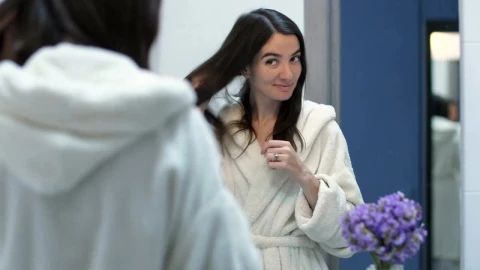Stock Footage Woman Smiling As She Looks In The Mirror Live Wallpaper Free - Free Live Wallpaper