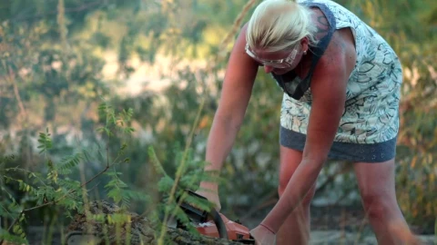Stock Footage Woman Using A Chainsaw Without Protection Live Wallpaper Free - Free Live Wallpaper