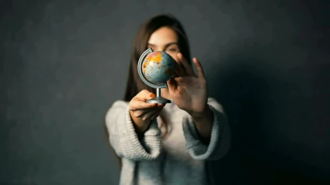 Stock Footage Woman Spins A Small World Globe Live Wallpaper Free - Free Live Wallpaper