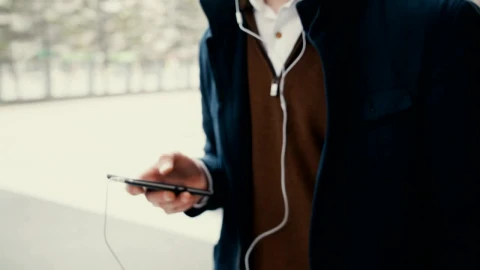 Stock Footage Young Student Listening To Music From His Mobile Live Wallpaper Free - Free Live Wallpaper