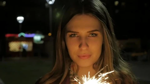 Stock Footage Woman Holding Two Sparklers Live Wallpaper Free - Free Live Wallpaper