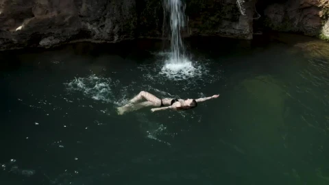 Stock Footage Woman Swimming In A Pond With A Little Waterfall Live Wallpaper Free - Free Live Wallpaper