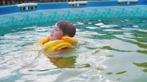 Stock Footage Young Boy With Inflatable Vest Swimming In The Pool Live Wallpaper Free - Free Live Wallpaper