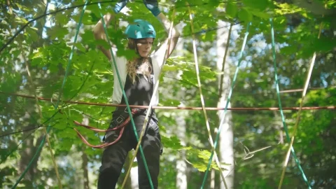 Stock Footage Young Woman Crossing The Ropes In The Woods Live Wallpaper Free - Free Live Wallpaper