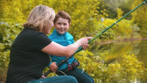 Stock Footage Woman Teaching A Boy To Fish Live Wallpaper Free - Free Live Wallpaper