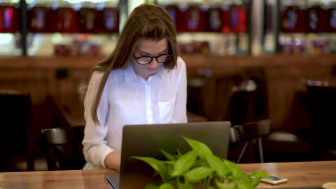 Stock Footage Young Woman Working On A Laptop And Talking On The Live Wallpaper Free - Free Live Wallpaper