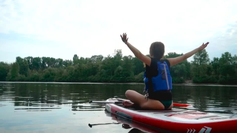 Stock Footage Woman Does Yoga Routine On Paddle Board In River Live Wallpaper Free - Free Live Wallpaper