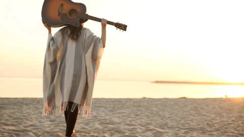 Stock Footage Woman Walks On Sunset Beach With Acoustic Guitar Live Wallpaper Free - Free Live Wallpaper