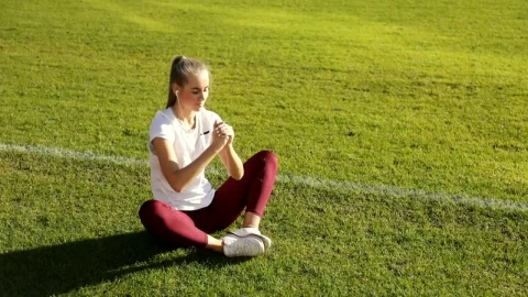 Stock Footage Young Runner Does Stretch Routine On Track Field Live Wallpaper Free - Free Live Wallpaper