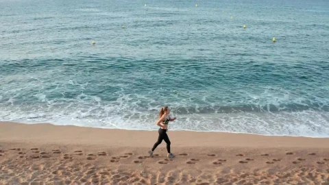 Stock Footage Woman Running By Shallow Waves Live Wallpaper Free - Free Live Wallpaper