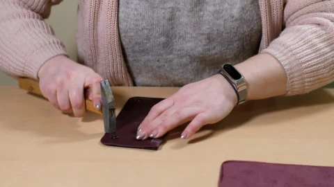 Stock Footage Woman Repairing A Wallet Live Wallpaper Free - Free Live Wallpaper