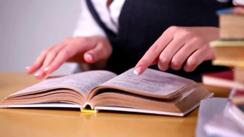 Stock Footage Woman Looking For Information In A Book At Library Live Wallpaper Free - Free Live Wallpaper