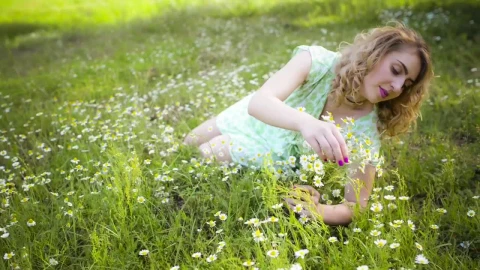Stock Footage Woman Lying On The Meadow Gathering Flowers Live Wallpaper Free - Free Live Wallpaper
