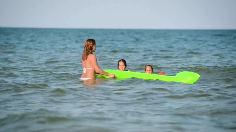 Stock Footage Young Mother With Her Daughters At The Sea Live Wallpaper Free - Free Live Wallpaper