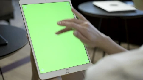 Stock Footage Woman Swiping Fingers On A Tablet Live Wallpaper Free - Free Live Wallpaper