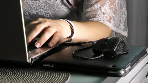 Stock Footage Woman Using Her Laptop At A Desk Medium Shot Live Wallpaper Free - Free Live Wallpaper