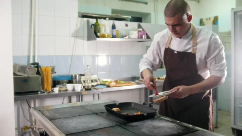 Stock Footage Young Chef Preparing A Meal In The Kitchen Live Wallpaper Free - Free Live Wallpaper