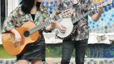 Stock Footage Young Man And Woman Playing Music On A Colorful Street Live Wallpaper Free - Free Live Wallpaper