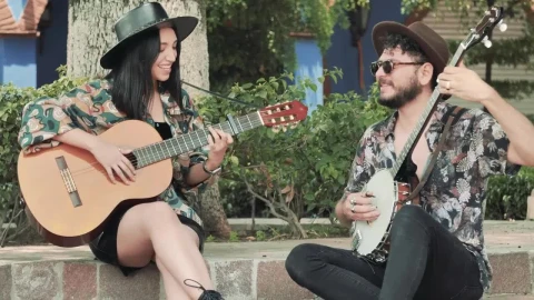 Stock Footage Young Man And Woman Playing Music In A Park Live Wallpaper Free - Free Live Wallpaper