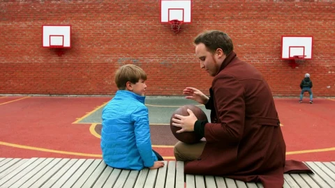Stock Footage Young Man And His Little Brother On The Basketball Playground Live Wallpaper Free - Free Live Wallpaper