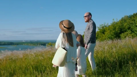 Stock Footage Young Family Walking Down The Hill To The River Live Wallpaper Free - Free Live Wallpaper