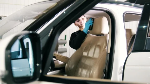 Stock Footage Young Woman Cleaning The Interior Of A Luxury Car Live Wallpaper Free - Free Live Wallpaper
