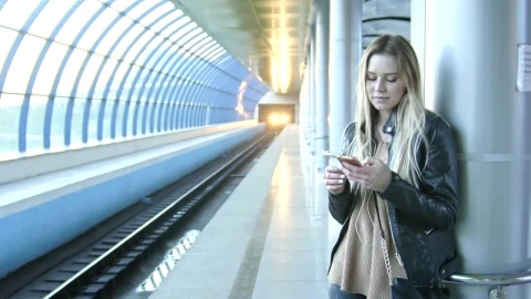 Stock Footage Young Woman Texting On Her Mobile Phone At The Metro Live Wallpaper Free - Free Live Wallpaper