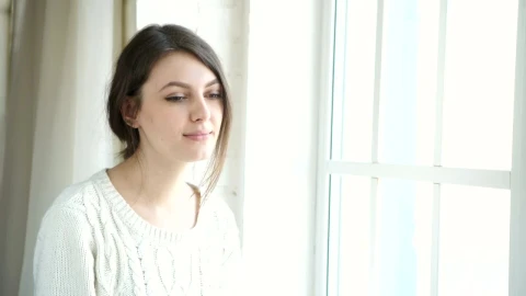 Stock Footage Young Woman Sips Tea Near Bright Sunny Window Live Wallpaper Free - Free Live Wallpaper