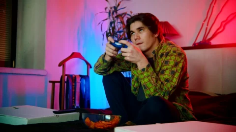 Stock Footage Young Man Plating Video Games On The Bed Live Wallpaper Free - Free Live Wallpaper