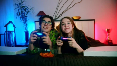 Stock Footage Young Couple Playing Video Games On The Bed Live Wallpaper Free - Free Live Wallpaper