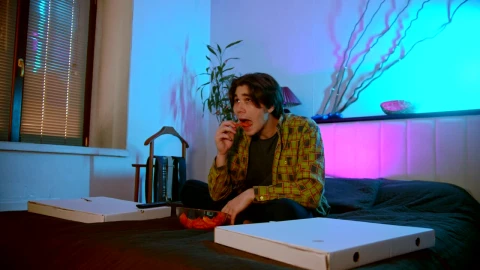 Stock Footage Young Man Eating Snacks While Watching A Movie Live Wallpaper Free - Free Live Wallpaper