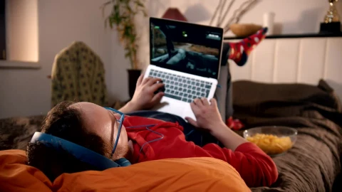Stock Footage Young Man Lying On The Bed Playing Video Games On Live Wallpaper Free - Free Live Wallpaper
