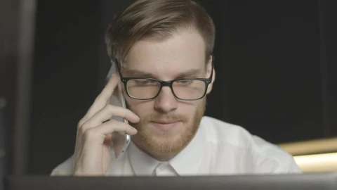 Stock Footage Worried Man On Phone Call Stares At Laptop Live Wallpaper Free - Free Live Wallpaper