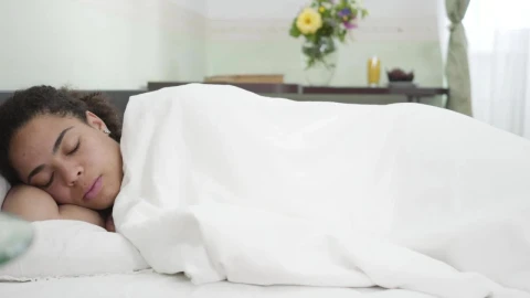 Stock Footage Woman Sleeps Blissfully Through Alarm Live Wallpaper Free - Free Live Wallpaper