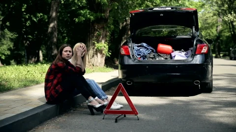 Stock Footage Young Women Sit On Curb After Auto Accident Live Wallpaper Free - Free Live Wallpaper