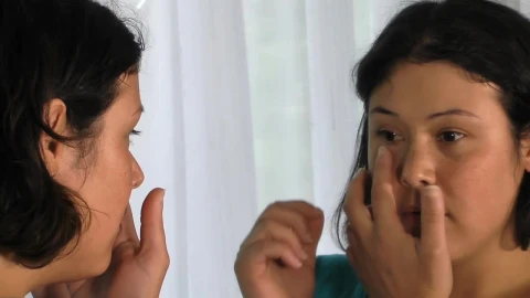 Stock Footage Woman Removing A Prosthesis Eye In The Mirror Live Wallpaper Free - Free Live Wallpaper