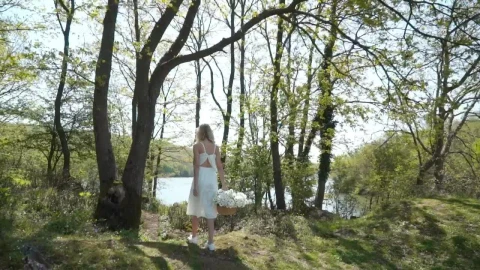 Stock Footage Woman Walking By A Lake With Flowers Live Wallpaper Free - Free Live Wallpaper