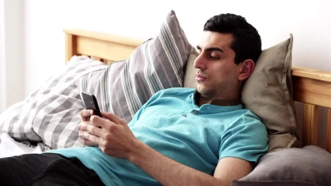 Stock Footage Young Man Relaxing With His Phone Live Wallpaper Free - Free Live Wallpaper