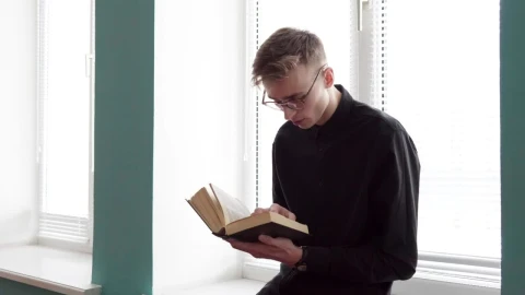 Stock Footage Young Man Reading Against The Window Live Wallpaper Free - Free Live Wallpaper