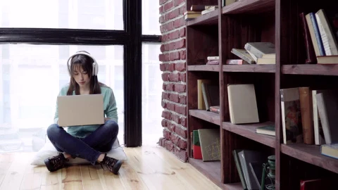 Stock Footage Woman Listing To Music While Typing Live Wallpaper Free - Free Live Wallpaper