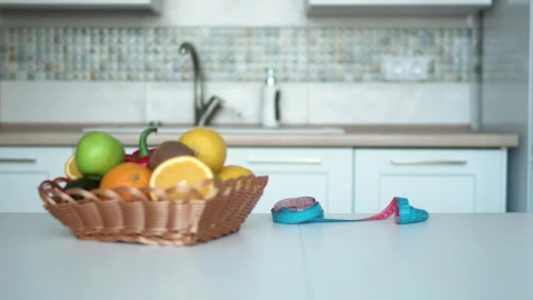 Stock Footage Woman Measuring Her Waist In The Kitchen Live Wallpaper Free - Free Live Wallpaper
