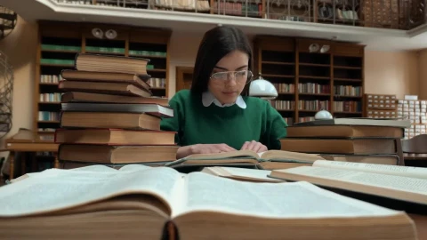 Stock Footage Woman Researching In Library Sits Back With Idea Live Wallpaper Free - Free Live Wallpaper